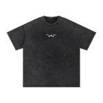 Black t-shirt with a small white logo on a white background